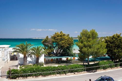 a view of the beach and ocean from a building at Residenza Del Mare in Sant'Isidoro