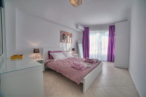 Postel nebo postele na pokoji v ubytování Downtown Glyfada smart apartment