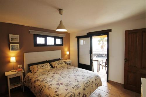 A bed or beds in a room at Apartamento La Finca