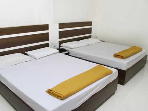 Postel nebo postele na pokoji v ubytování Mp Residency
