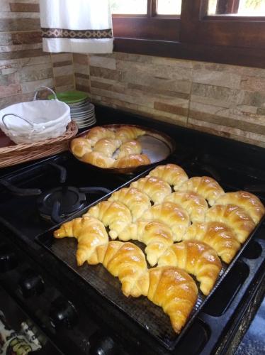 a bunch of pastries sitting on top of a stove at Cabañas Abigail in Nono