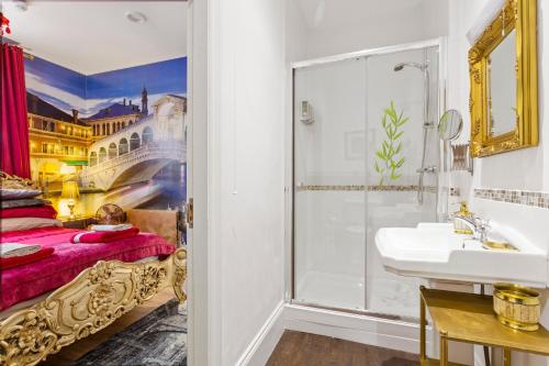 a bathroom with a shower and a bed and a sink at Mama’s Inn Boutique Guest House in Nottingham