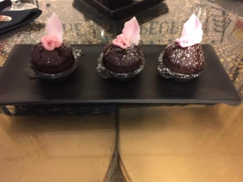 three chocolate cakes with pink bunny ears on a black tray at Mama’s Inn Boutique Guest House in Nottingham