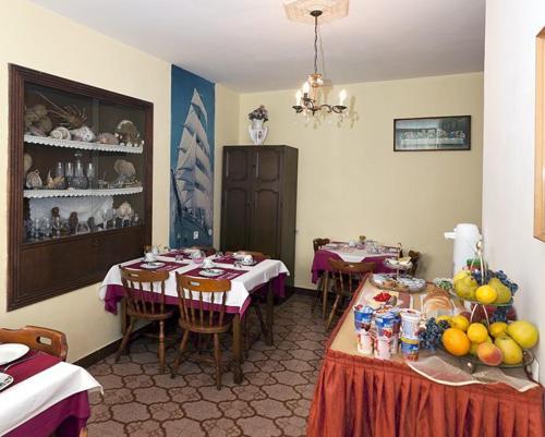 a dining room with two tables in a room at Villa Roko in Tučepi
