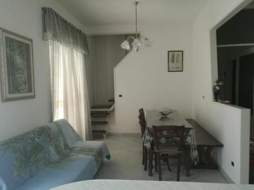 a living room with a couch and a table at Casa Santa Gemma in Camaiore