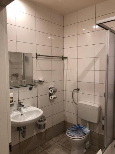 Koupelna v ubytování Hotel Poseidon