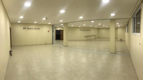a large empty room with a tennis court in it at Ipê Palace Hotel in Adamantina