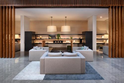 a living room with couches and a table at Inspira Liberdade Boutique Hotel in Lisbon