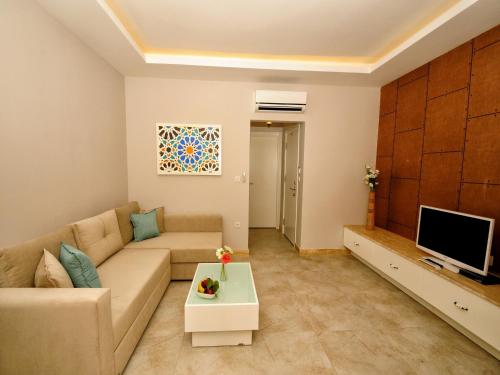 Televisyen dan/atau pusat hiburan di Sea Breeze Hotel and Apartments