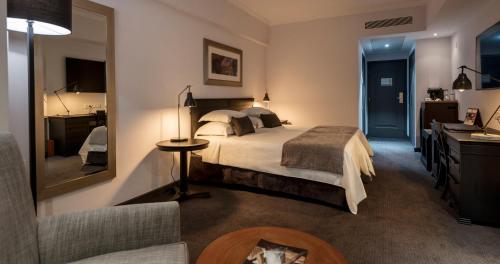 Cama o camas de una habitación en Hotel Avenida