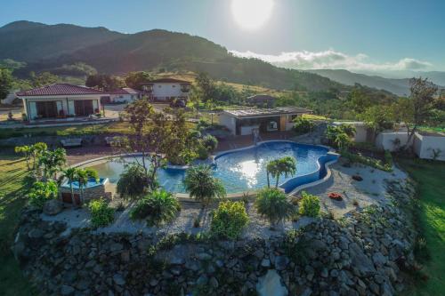 an aerial view of a swimming pool at a resort at Vida Mountain Resort & Spa Adults Only in San Ramón