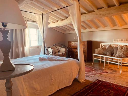 Ένα ή περισσότερα κρεβάτια σε δωμάτιο στο Podere Il Castellaccio