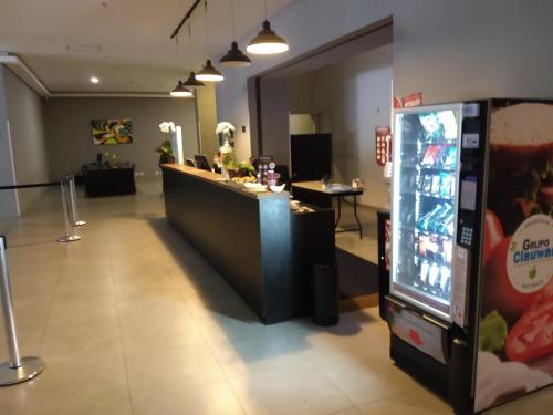 a cashier counter in a store with a video game at Ap 513 Manacás in Itaipava