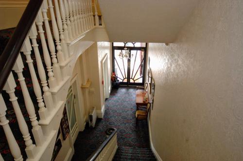 an overhead view of a hallway with stairs at The Maynard in Scarborough