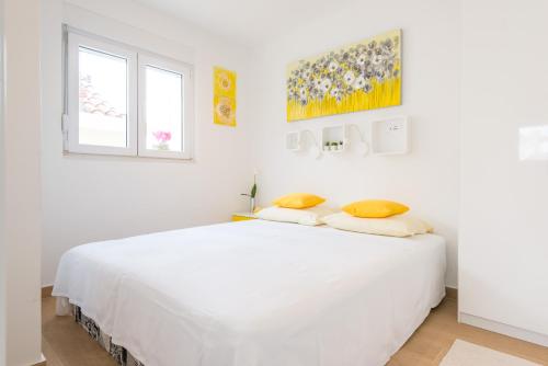 Posteľ alebo postele v izbe v ubytovaní Apartment Portolan