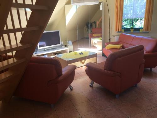 TV a/nebo společenská místnost v ubytování Ferienappartements Anke Lange