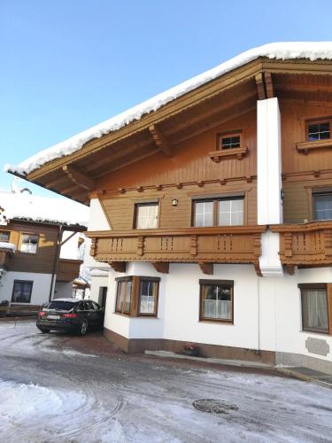 a building with a car parked in front of it at Arenablick in Zell am Ziller
