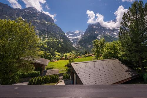 a view from a house with mountains in the background at Luftschloss in Grindelwald