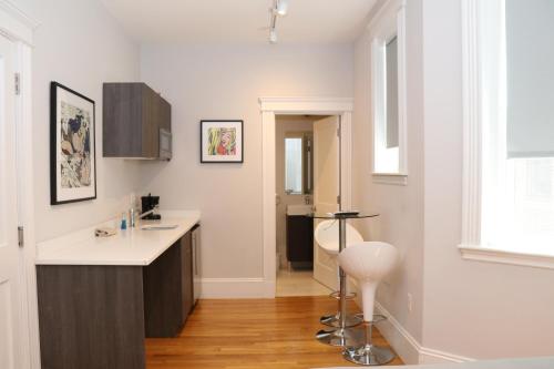 a kitchen with a sink and a counter top at A Stylish Stay w/ a Queen Bed, Heated Floors.. #32 in Brookline