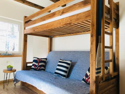 a bedroom with a bunk bed with pillows on it at APARTMAN Bervida Murter in Murter