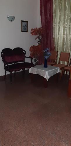 a living room with a couch and a table at Residencial Central in Caldas da Rainha
