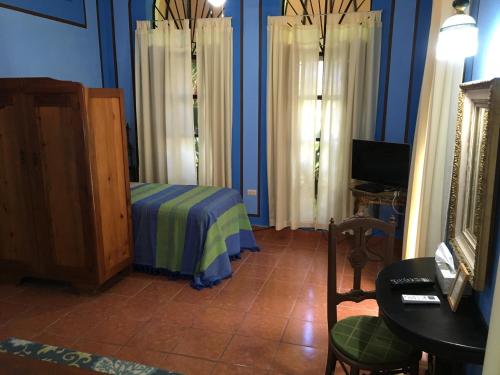 Cama o camas de una habitación en Hacienda San Pedro Nohpat
