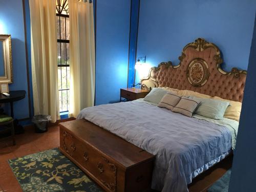 Postel nebo postele na pokoji v ubytování Hacienda San Pedro Nohpat