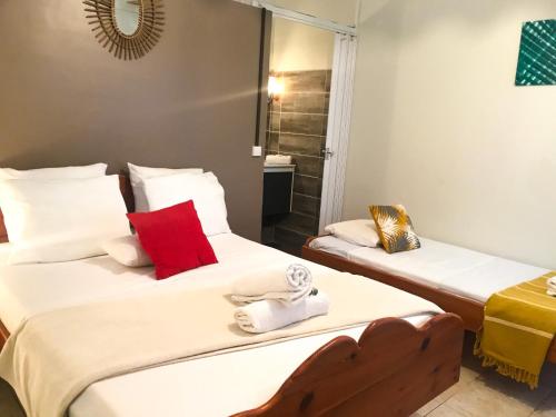 Ein Bett oder Betten in einem Zimmer der Unterkunft Hotel Oasis