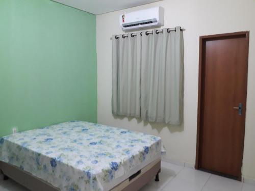 A bed or beds in a room at Casa Hospedagem Petrolina