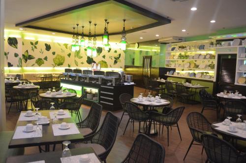 a dining room with tables and chairs and a restaurant at El Cielito Inn - Sta. Rosa in Santa Rosa