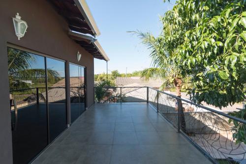 a balcony of a house with a view of the beach at Casa Temporada Castro Alves in Bonito
