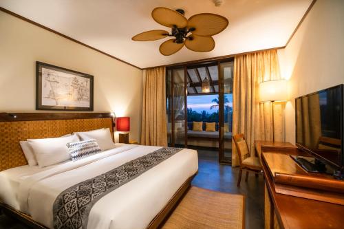 Кровать или кровати в номере Kuta Seaview Boutique Resort
