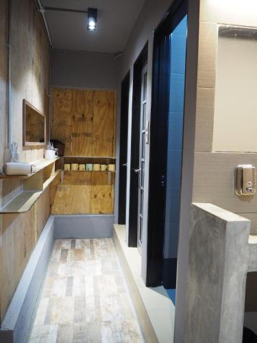 a large bathroom with a sink and a tub at Leo Leisure Hotel @ Central Market in Kuala Lumpur