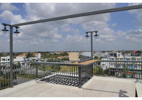 a balcony with a view of a city at Cherry Hotel Bến Lức in Bến Lức