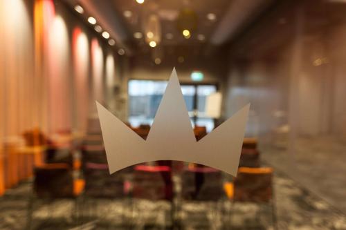 a white arrows sign on a table in a room at Best Western Malmo Arena Hotel in Malmö