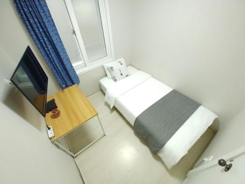 Posteľ alebo postele v izbe v ubytovaní Hause Itaewon