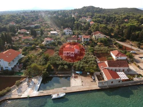 an aerial view of a house on a island in the water at Family House Rebeka in Ugljan