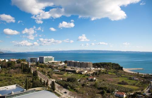 a view of a city and the ocean with buildings at Apartment Amalfi in Split