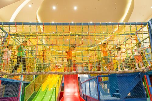 a group of children playing on an indoor play structure at Kerry Hotel, Beijing by Shangri-La - 5 Kilometers to The Forbidden City in Beijing