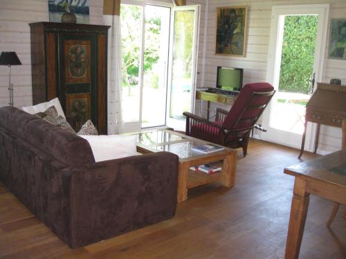 a living room with a couch and a coffee table at BnB Atelier de St. Maurice in Vésenaz