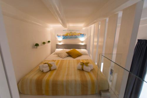 A bed or beds in a room at Little House