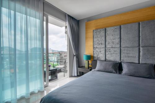 Postel nebo postele na pokoji v ubytování Emerald Terrace Resort