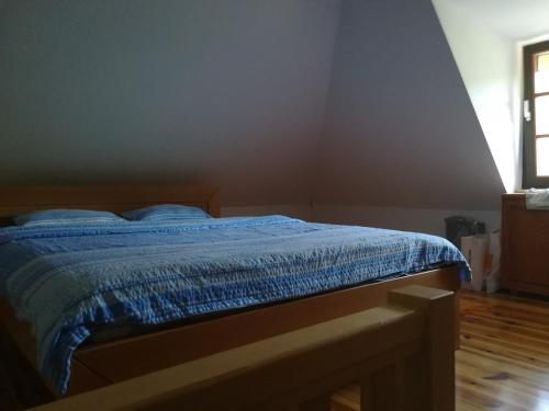 Postel nebo postele na pokoji v ubytování Brvnara na obali reke Drine