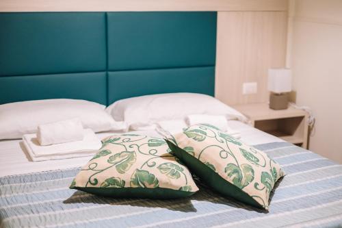 Appartamento la Ninfea tesisinde bir odada yatak veya yataklar