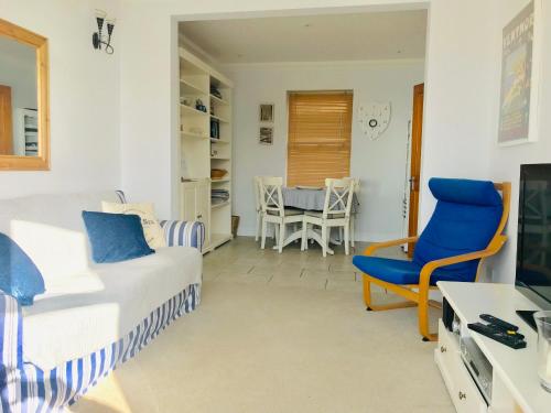 a living room with a couch and a chair at Southgrove View, Family Holiday Cottage in Ventnor