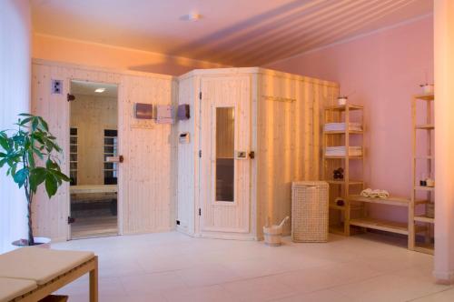 a bathroom with white walls and a room with a toilet at Weisses Lamm in Hallstatt