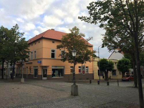 a building with a street light in front of it at Villa Linde Franke in Bernburg