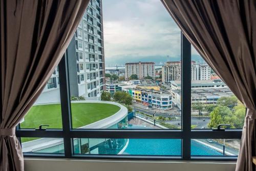 a window view of a city from a hotel room at Woodsbury by Micheal Butterworth Penang 7722 in Butterworth
