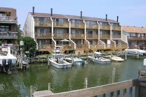 a large hotel with boats docked in a marina at Sea Jay Townhouse 616C in Ocean City