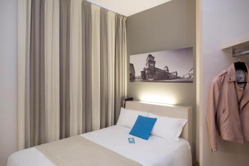 Krevet ili kreveti u jedinici u okviru objekta B&B Hotel Ferrara